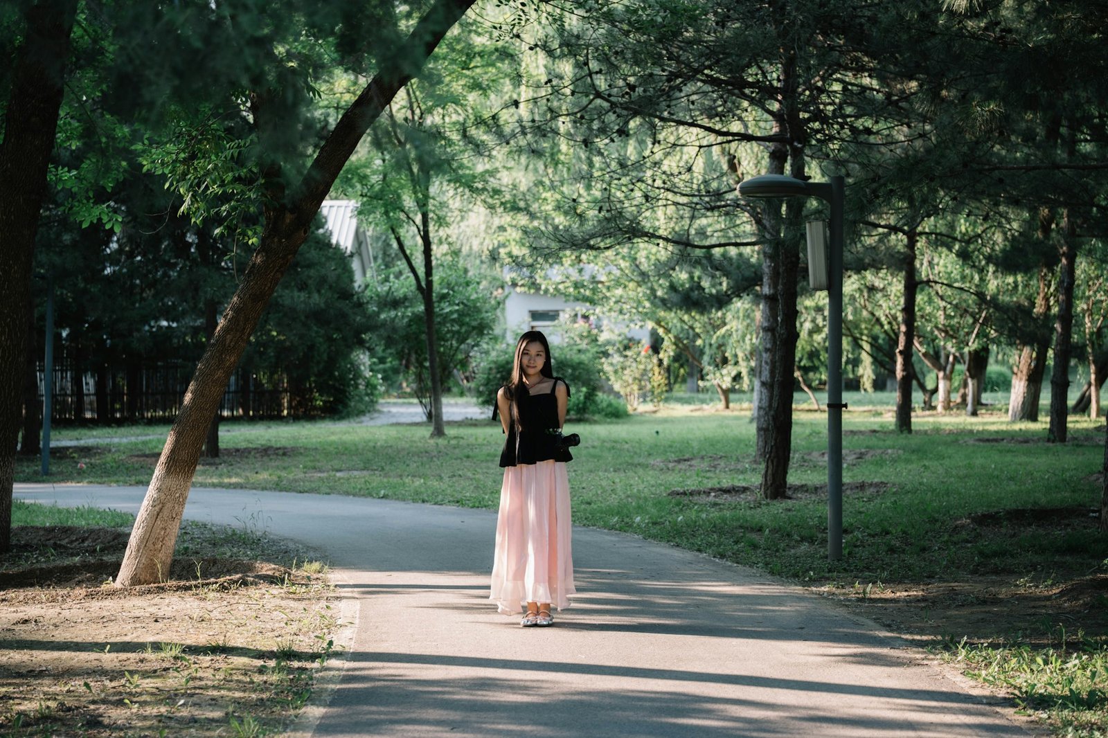 A person walking toward a bright next step outdoors